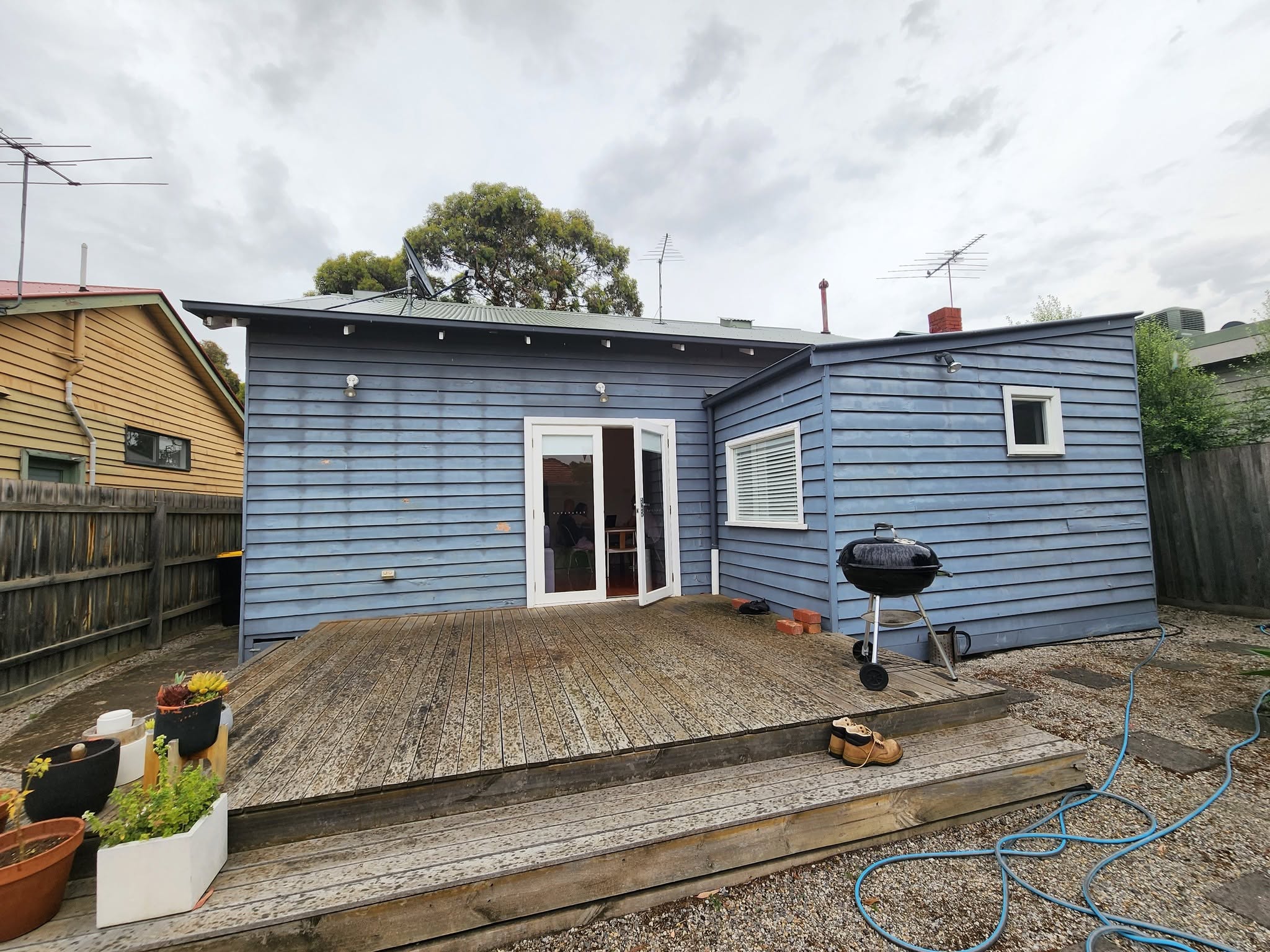 Before: weatherboard home transformed with a brick and metal-clad rear extension